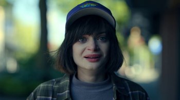 Movie still from “The Midnight Club” (2022), created by Mike Flanagan – A person wearing a cap; Close Up shot, High angle