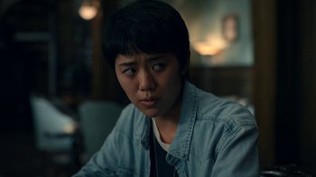 Movie still from “The Midnight Club” (2022), created by Mike Flanagan – A person sitting in front of a window looking at the camera; Close Up shot, Over the shoulder angle