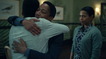 Movie still from “The Midnight Club” (2022), created by Mike Flanagan – Two men hugging in front of two women; Medium shot, Over the shoulder angle