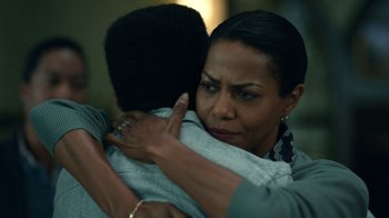 Movie still from “The Midnight Club” (2022), created by Mike Flanagan – A woman is hugging a young man in a room; Close Up shot, Over the shoulder angle