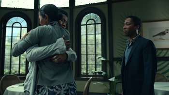 Movie still from “The Midnight Club” (2022), created by Mike Flanagan – A group of people standing in front of a window; Medium shot, Over the shoulder angle