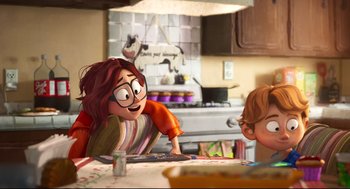 Movie still from “The Mitchells vs the Machines” (2021), directed by Jeff Rowe – A woman and a boy sitting at a kitchen table; Medium shot, Over the shoulder angle