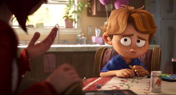 Movie still from “The Mitchells vs the Machines” (2021), directed by Jeff Rowe – A cartoon of a boy sitting at a dining table; Medium shot, Over the shoulder angle