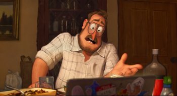 Movie still from “The Mitchells vs the Machines” (2021), directed by Jeff Rowe – An animated man sitting in front of a computer; Medium shot, Over the shoulder angle