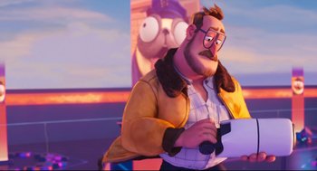 Movie still from “The Mitchells vs the Machines” (2021), directed by Jeff Rowe – An animated man with glasses and a beard; Medium shot, Over the shoulder angle