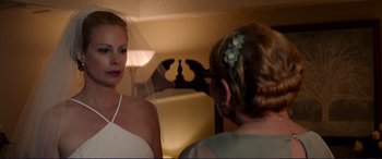 Movie still from “The Mule” (2018), directed by Clint Eastwood – A woman in a white dress looking in the mirror; Close Up shot, Over the shoulder angle