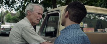 Movie still from “The Mule” (2018), directed by Clint Eastwood – Two men talking to each other in front of a truck; Close Up shot, Over the shoulder angle