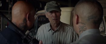 Movie still from “The Mule” (2018), directed by Clint Eastwood – A person wearing a hat; Close Up shot, Over the shoulder angle