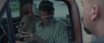 Movie still from “The Mule” (2018), directed by Clint Eastwood – An older man sitting in a car looking out the window; Close Up shot, Over the shoulder angle
