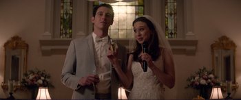 Movie still from “The Mule” (2018), directed by Clint Eastwood – A man and a woman standing next to each other; Medium shot, Low angle