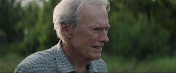Movie still from “The Mule” (2018), directed by Clint Eastwood – An older man with white hair looking to his left; Close Up shot, Over the shoulder angle