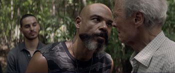 Movie still from “The Mule” (2018), directed by Clint Eastwood – A man with a beard and a man with a beard; Close Up shot, Over the shoulder angle