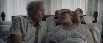 Movie still from “The Mule” (2018), directed by Clint Eastwood – An older man and a younger woman sitting next to each other; Close Up shot, Over the shoulder angle