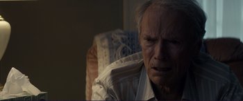 Movie still from “The Mule” (2018), directed by Clint Eastwood – An older man with a white shirt and a white shirt; Close Up shot, Over the shoulder angle