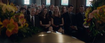 Movie still from “The Mule” (2018), directed by Clint Eastwood – A group of people sitting around a table; Wide shot, High angle