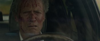 Movie still from “The Mule” (2018), directed by Clint Eastwood – An old man with blood all over his face; Close Up shot, Low angle