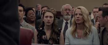 Movie still from “The Mule” (2018), directed by Clint Eastwood – A group of people sitting in a courtroom; Close Up shot, Over the shoulder angle