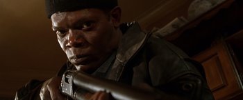 Movie still from “The Negotiator” (1998), directed by F. Gary Gray – A person holding a baseball bat; Close Up shot, Low angle