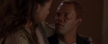 Movie still from “The Negotiator” (1998), directed by F. Gary Gray – A man and a woman looking at one another; Close Up shot, Over the shoulder angle