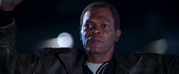 Movie still from “The Negotiator” (1998), directed by F. Gary Gray – A person wearing a jacket; Close Up shot, Low angle