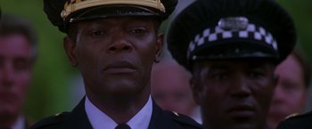 Movie still from “The Negotiator” (1998), directed by F. Gary Gray – A man in a police uniform and a man in a police uniform; Close Up shot, Low angle
