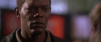 Movie still from “The Negotiator” (1998), directed by F. Gary Gray – A man's face in front of a blurry background; Close Up shot, Low angle