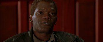 Movie still from “The Negotiator” (1998), directed by F. Gary Gray – A person wearing a leather jacket; Close Up shot, Low angle