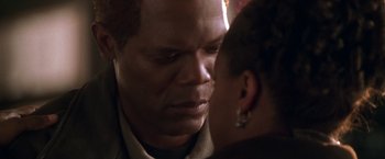 Movie still from “The Negotiator” (1998), directed by F. Gary Gray – A person looking at another person; Close Up shot, Over the shoulder angle