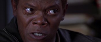 Movie still from “The Negotiator” (1998), directed by F. Gary Gray – A person's eyes and face; Close Up shot, Low angle