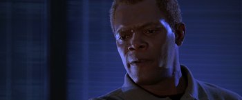 Movie still from “The Negotiator” (1998), directed by F. Gary Gray – A man's face in a dark room; Close Up shot, Low angle