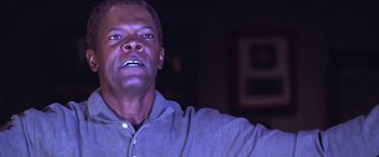 Movie still from “The Negotiator” (1998), directed by F. Gary Gray – A person looking up at the ceiling; Close Up shot, Low angle