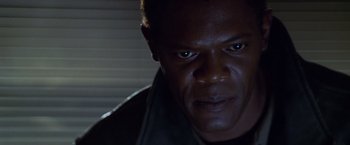 Movie still from “The Negotiator” (1998), directed by F. Gary Gray – A man's face in the dark; Close Up shot, Low angle