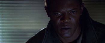 Movie still from “The Negotiator” (1998), directed by F. Gary Gray – A man's face in the dark; Close Up shot, Low angle