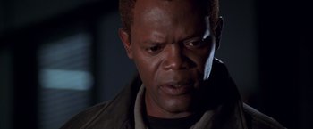 Movie still from “The Negotiator” (1998), directed by F. Gary Gray – A man with a concerned look on his face; Close Up shot, High angle