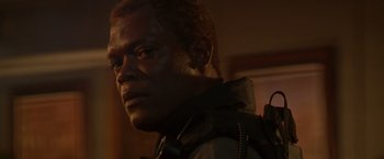 Movie still from “The Negotiator” (1998), directed by F. Gary Gray – A person wearing a jacket; Close Up shot, Low angle