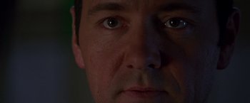Movie still from “The Negotiator” (1998), directed by F. Gary Gray – A man's eyes at night; Extreme Close Up shot, Low angle