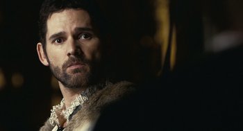 Movie still from “The Other Boleyn Girl” (2008), directed by Justin Chadwick – A man with a beard wearing a fur coat; Close Up shot, Over the shoulder angle