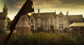 Movie still from “The Other Boleyn Girl” (2008), directed by Justin Chadwick – An old house with an umbrella in the foreground; Extreme Wide shot, Low angle
