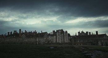 Movie still from “The Other Boleyn Girl” (2008), directed by Justin Chadwick – A dark sky over an old town with a lot of buildings; Extreme Wide shot, Low angle