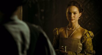 Movie still from “The Other Boleyn Girl” (2008), directed by Justin Chadwick – A beautiful young lady holding a cup in front of a mirror; Close Up shot, Over the shoulder angle