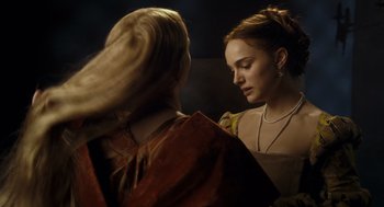 Movie still from “The Other Boleyn Girl” (2008), directed by Justin Chadwick – Two women are looking at each other in a dark room; Close Up shot, Over the shoulder angle