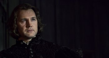 Movie still from “The Other Boleyn Girl” (2008), directed by Justin Chadwick – A person wearing a suit and tie; Close Up shot, Over the shoulder angle