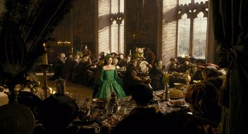 Movie still from “The Other Boleyn Girl” (2008), directed by Justin Chadwick – A group of people sitting around a room; Wide shot, Over the shoulder angle