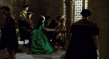 Movie still from “The Other Boleyn Girl” (2008), directed by Justin Chadwick – A group of people sitting around a table playing a game; Wide shot, Over the shoulder angle