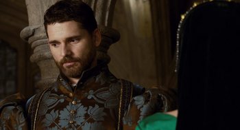 Movie still from “The Other Boleyn Girl” (2008), directed by Justin Chadwick – A man with a long beard wearing a suit and tie; Close Up shot, Over the shoulder angle