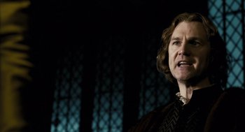 Movie still from “The Other Boleyn Girl” (2008), directed by Justin Chadwick – An older woman standing in front of a dark background; Close Up shot, Low angle