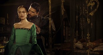 Movie still from “The Other Boleyn Girl” (2008), directed by Justin Chadwick – A man and a woman in medieval garb in a room; Medium shot, Over the shoulder angle