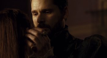 Movie still from “The Other Boleyn Girl” (2008), directed by Justin Chadwick – A person with a beard holding something; Close Up shot, Over the shoulder angle