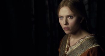 Movie still from “The Other Boleyn Girl” (2008), directed by Justin Chadwick – A young woman in a medieval dress looking at the camera; Close Up shot, Over the shoulder angle