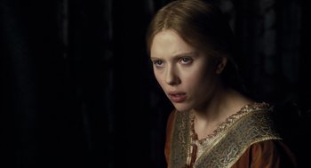 Movie still from “The Other Boleyn Girl” (2008), directed by Justin Chadwick – A young woman in a red and gold dress; Close Up shot, Over the shoulder angle